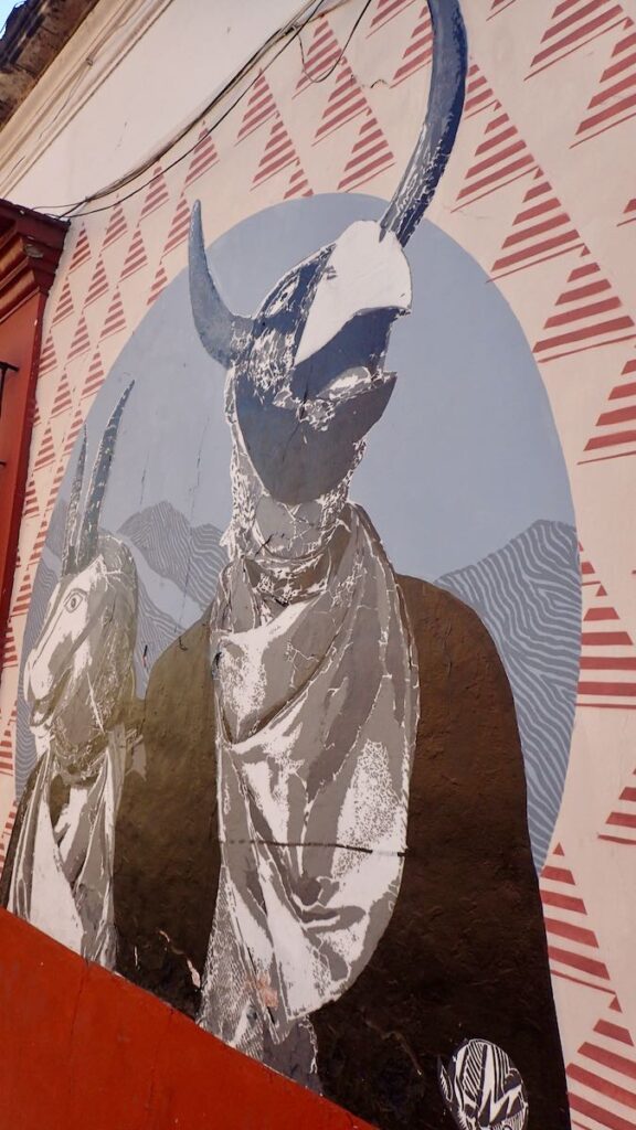 mural of person with horned eagle head