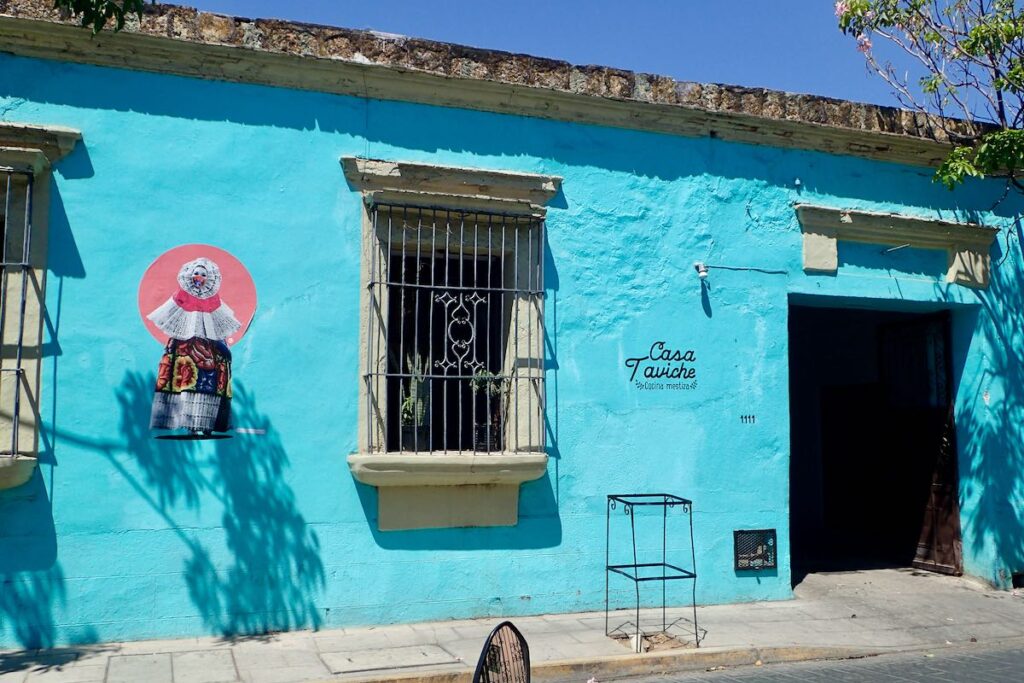 small painting of a woman on the wall of Casa Taviche